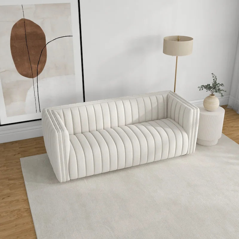 Canapé trois places dossier touffeté en tissu bouclé crème